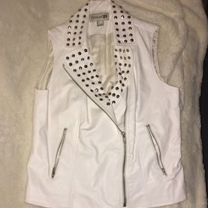 White studded "leather" vest.